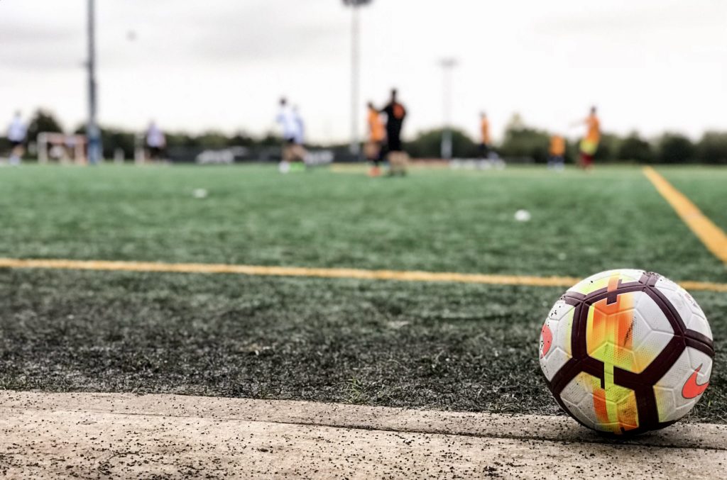 Soccer field with close up of ball on sidelines