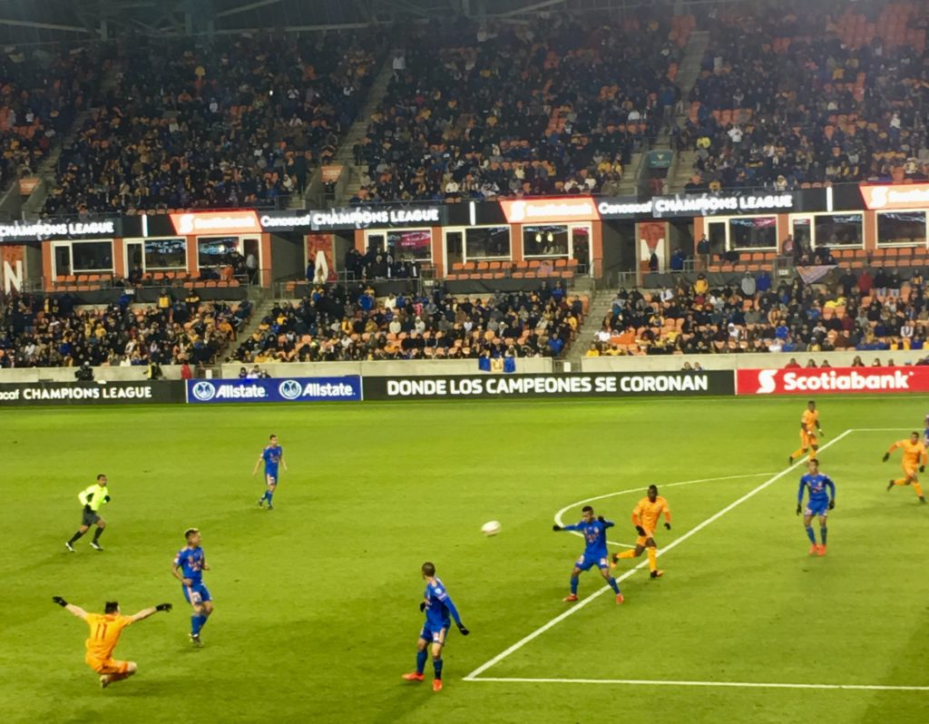 Dynamo midfielder Tommy McNamara (11) crosses the ball into the box.