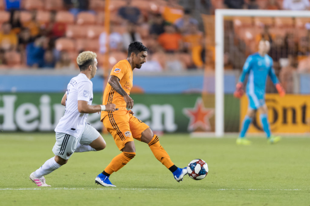 Dynamo defender A.J. DeLaGarza gets set to pass the ball