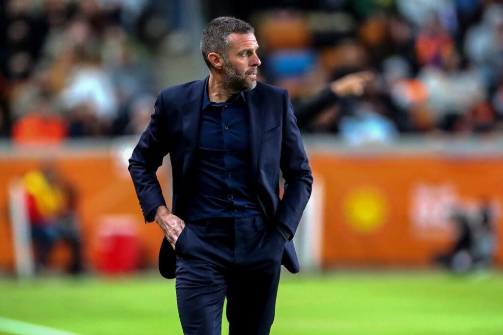 Houston Dynamo head coach Ben Olsen in a black suit.